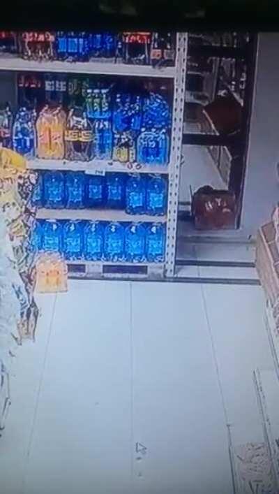 Bottle falls of the shelf but shoots itself back immediately