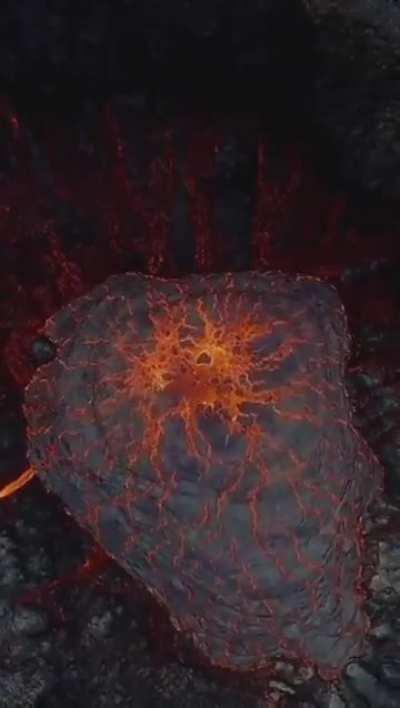 a drone hovering over an active volcano