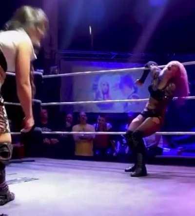 Kris Wolf kicks Little Miss Roxxy square in the vag