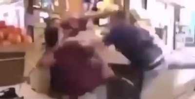 He was spitting on oranges, and the cashier slapped him