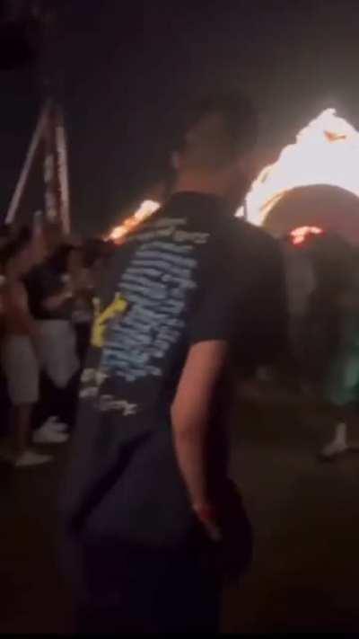 Throwing urine at a crowd