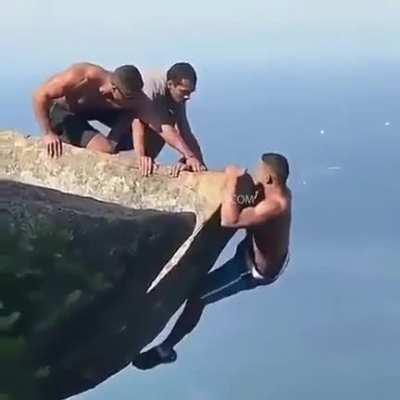 Dude almost falls to his death after trying to pose for an Off the cliff IG picture