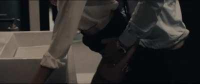 Charlize Theron getting clapped in Gringo