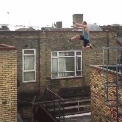 Free runner making a jump that doesn't look possible