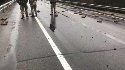 Ukrainian soliders cleaning the road of mines.