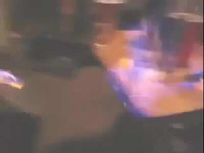 Flaming drink at house party