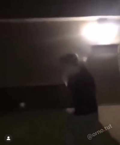 Throwing a bottle on the wall.