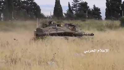 An Israeli Merkava staring down Lebanese RPG gunners while Indonesian peacekeeper stood in between them, Lebanon