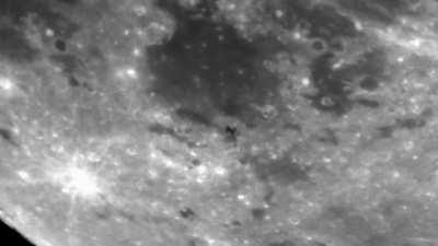 This is the International Space Station passing in front of the moon as seen from my backyard in Detroit. I show it in a slowed-down version then in real-time speed.