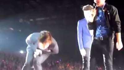 Harry Styles getting hit in the PP with a shoe