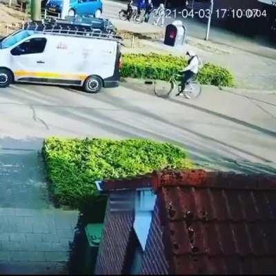 Dude uses his phone while cycling, and ends up face-planting into a van