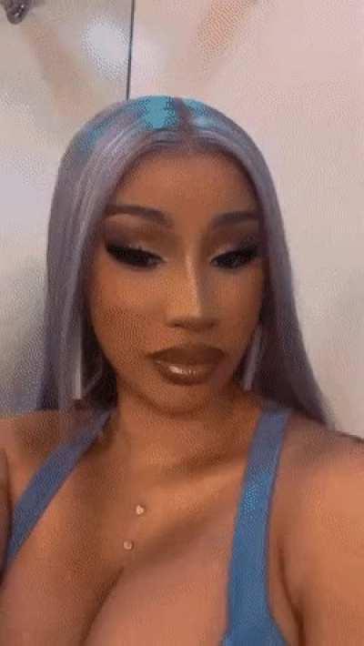 Cardi getting ready to take a big load all over her face and cleavage