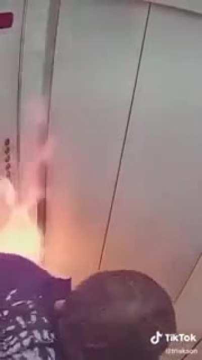 Guy plays with fire in an elevator. disaster ensues.