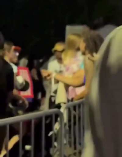 Harris Supporter screaming at child in stroller.