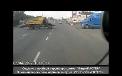After 2 trucks crash, the truck almost hits a man but the man did not get hit. 