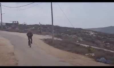 Man in IDF Uniform on Unicycle