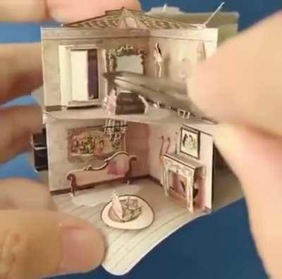 A miniature dollhouse in a book