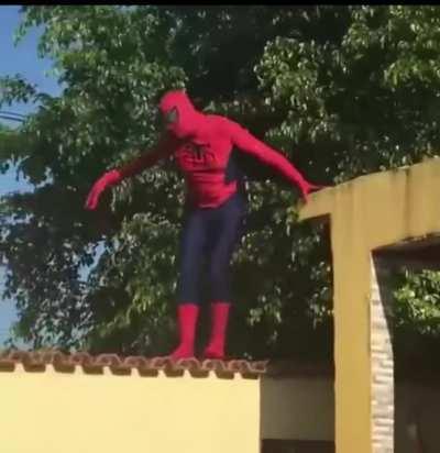 WCGW performing on a roof in a Spider-Man suit