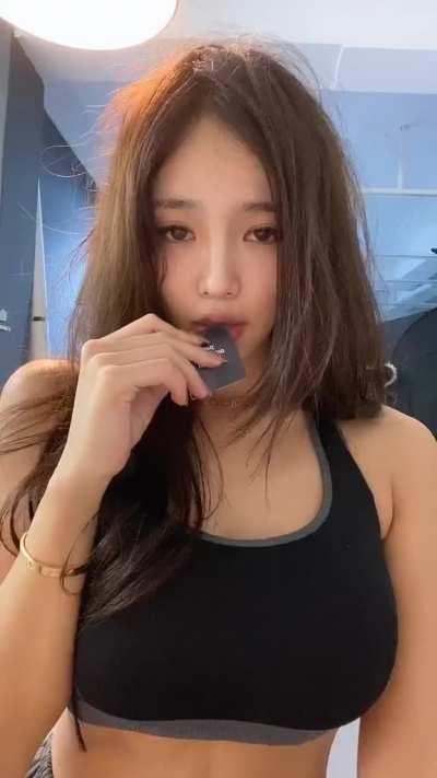 Opening with her teeth