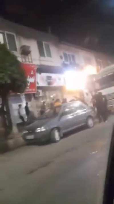 Family driving through protests as regime shoots people, then Basijis shoot and kill woman inside filming