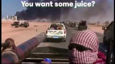Rebel fighters in Libya asking filmmaker Olivier Sarbil if he&rsquo;d like some juice during the battle of Sirte in 2011