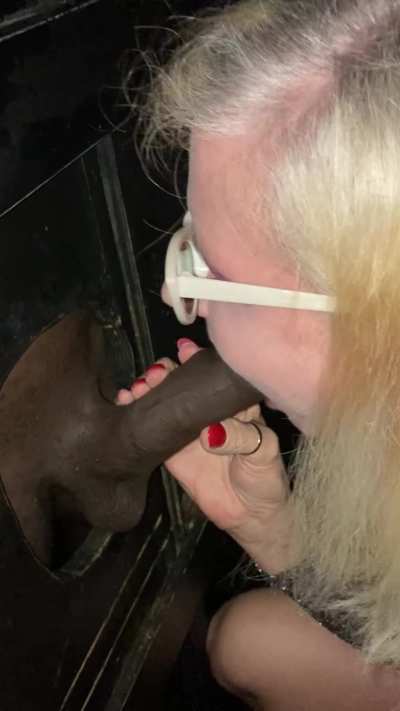 A Real Treat Enjoying a Thick Veiny Uncircumcised BBC Through the Gloryhole While Hubby Watches and take Video. See More Naughty Adventures here:   