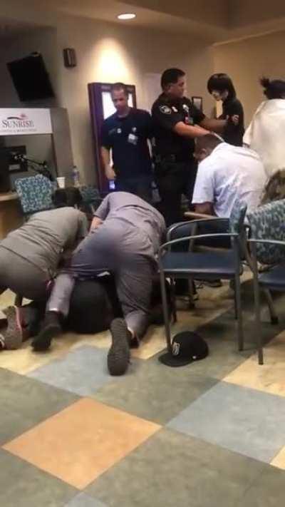 a guy getting assaulted and then he gets slammed by a doctor