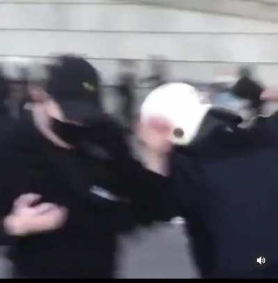 Cop attacks protestor in Sweden with baton after spraying tear gas on retreating protestors.