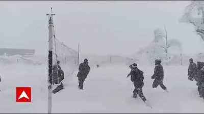 Indian soldiers playing volleyball in The heavy snowfall.