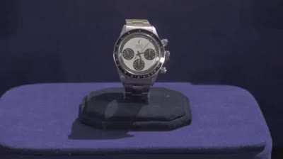 A Vietnam veteran looks up how much his Rolex is worth.