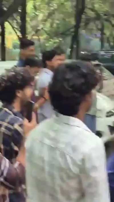 dedicated cameraman in college fight