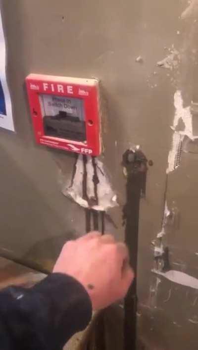 Pouring structural high flow cement into a steel post. Must have been a pin hole somewhere in it. Whole hotel evacuated in the snow.