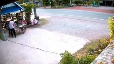 Thailand (?): Box truck flies into stand, almost killing someone