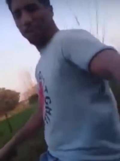 Riding a bike next to a car