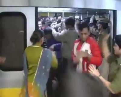 Indian police slapping Men who were travelling in the ladies coach of the New Delhi's metro