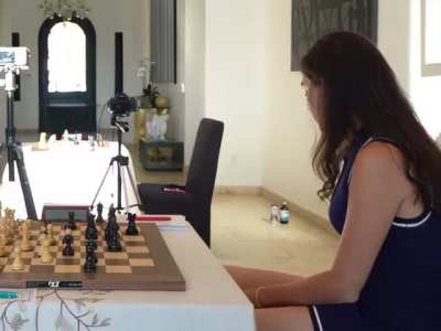 Short blue dress during chess match