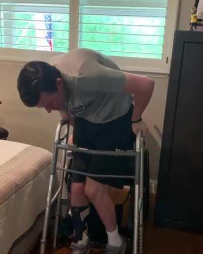 After 1,220 attempts at standing up from his wheelchair, Rob who is quadriplegic finally stood up on his own. Well done Rob!