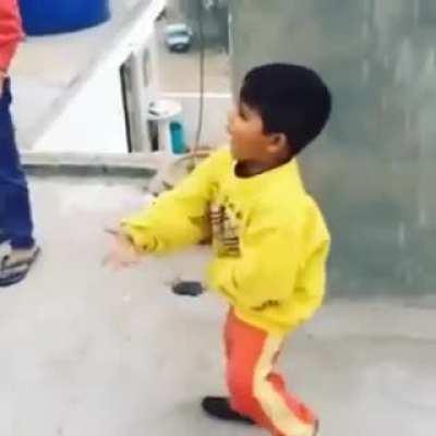 Kid gets angry while flying a kite.