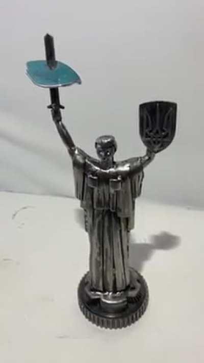 Piece of shot-down SU-34, with aircraft details engraved, impaled on Ukrainian Motherland Monument - Check the link in the comments to access the 