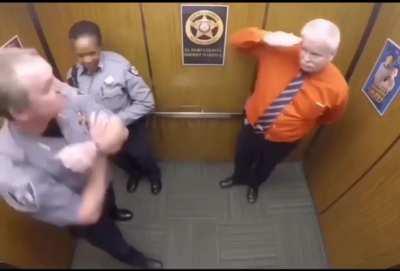 Buncha cops having fun dancing in the elevator, except Deputy Evans