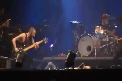 Fan falls on stage at a Paramore concert, and the band all lies down next to her.