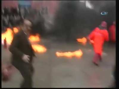 Man burns himself and then throws lighted up gas at other people