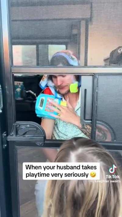 Father takes playing with his daughter very serious. 