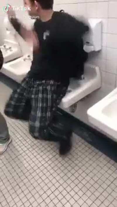 Sitting on a sink and dancing