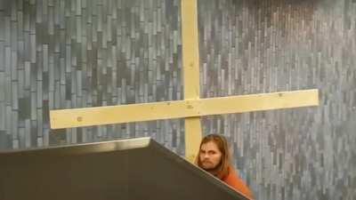 WCGW being Jesus and carrying the cross in the escalator.