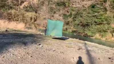 The tent is sentient and toying with him, moving at the perfect speed to give him hope, then snatch it away