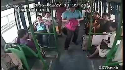 Karen suddenly grabs steering wheel but the driver was able to stop the bus.