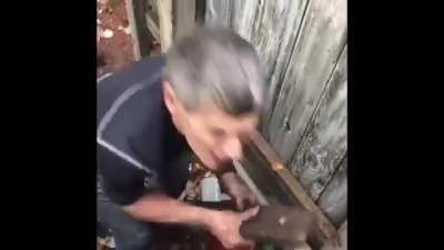 Woman reaches hand under neighbour's fence for no reason. Later accuses the neighbor of molesting and harrasing her before screaming at him.