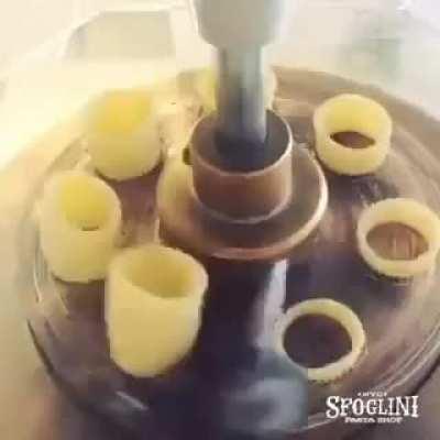 Pasta cutting machine shows how it can be mass produced. I've always thought it was much more complicated.
