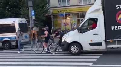 Polish police are helping to cover a truck with homophobic slongans